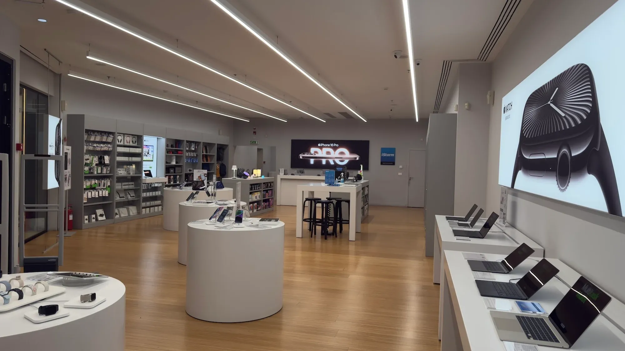 iStorm Apple Premium Partner store interior with iPhone and Apple Watch displays